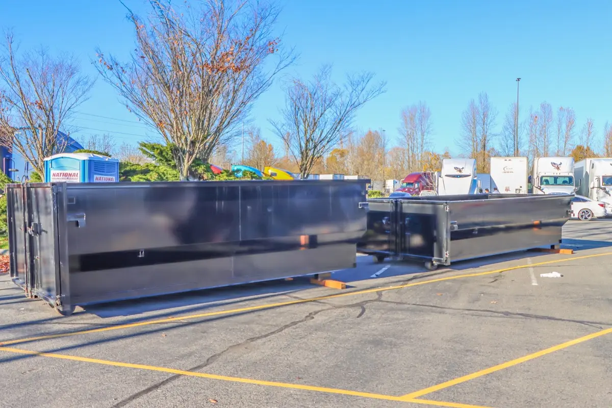 Professional dumpster rental service with roll-off container on residential driveway in Morgan Hill